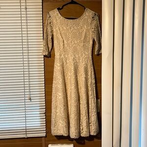 Beige with lace pattern past the knee dress by Melrose
